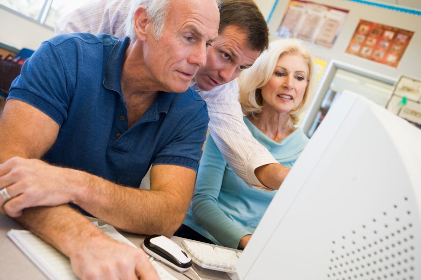 Mature students learning computer skills